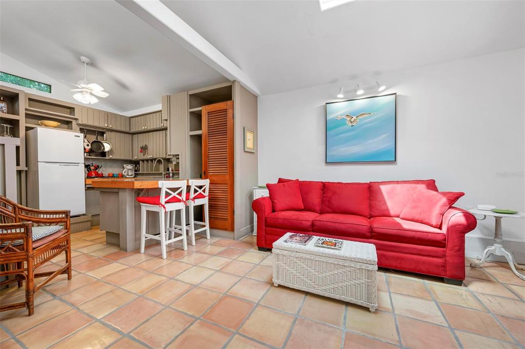 528 45th Street Sarasota, FL 34234 - Photo 30 of 45 a living room with furniture and a flat screen tv