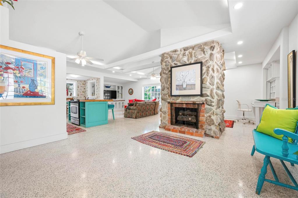 528 45th Street Sarasota, FL 34234 - Photo 3 of 45 a living room with furniture and a fireplace