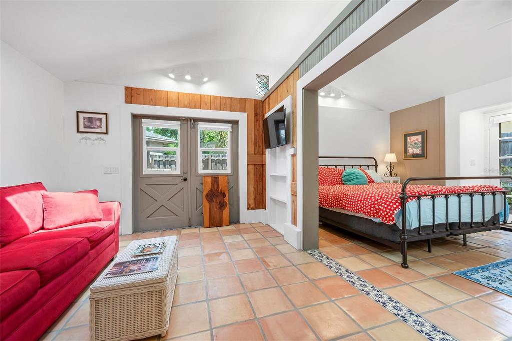 528 45th Street Sarasota, FL 34234 - Photo 34 of 45 a bedroom with a bed and a couch