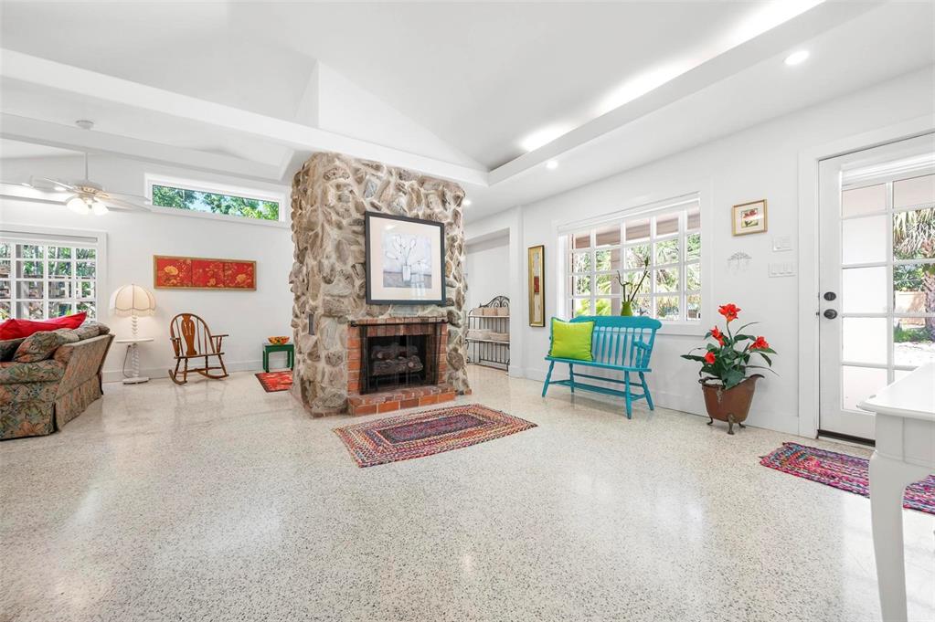 528 45th Street Sarasota, FL 34234 - Photo 4 of 45 a living room with furniture and a fireplace