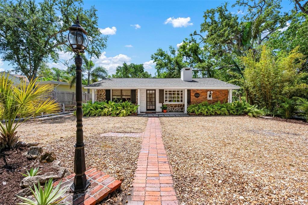 528 45th Street Sarasota, FL 34234 - Photo 45 of 45 a front view of a house with garden