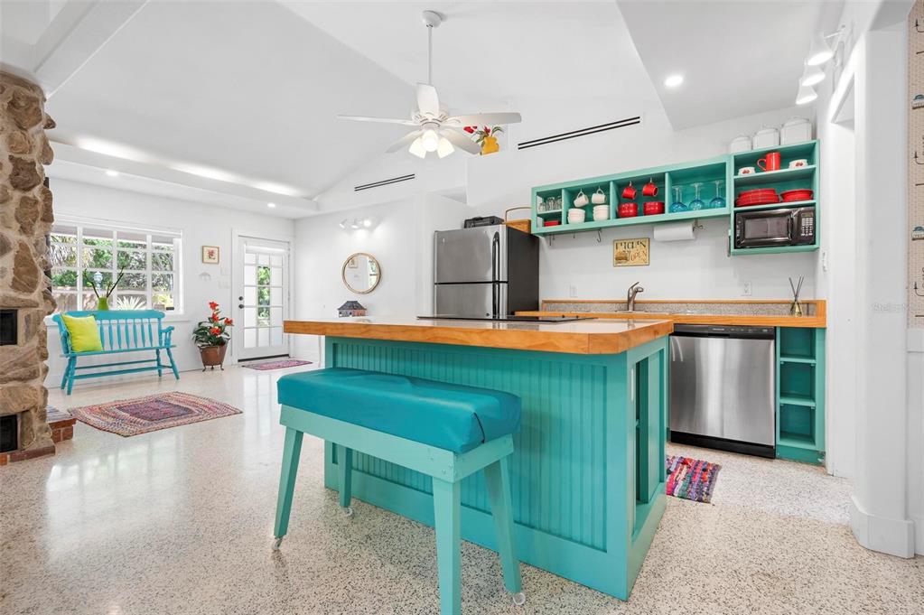 528 45th Street Sarasota, FL 34234 - Photo 6 of 45 a kitchen with stainless steel appliances granite countertop a refrigerator and a wooden cabinets