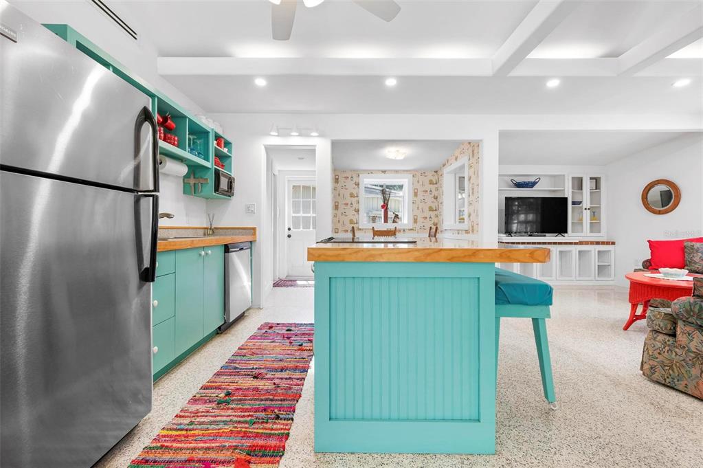528 45th Street Sarasota, FL 34234 - Photo 10 of 45 a kitchen with stainless steel appliances kitchen island granite countertop a refrigerator and a wooden cabinets