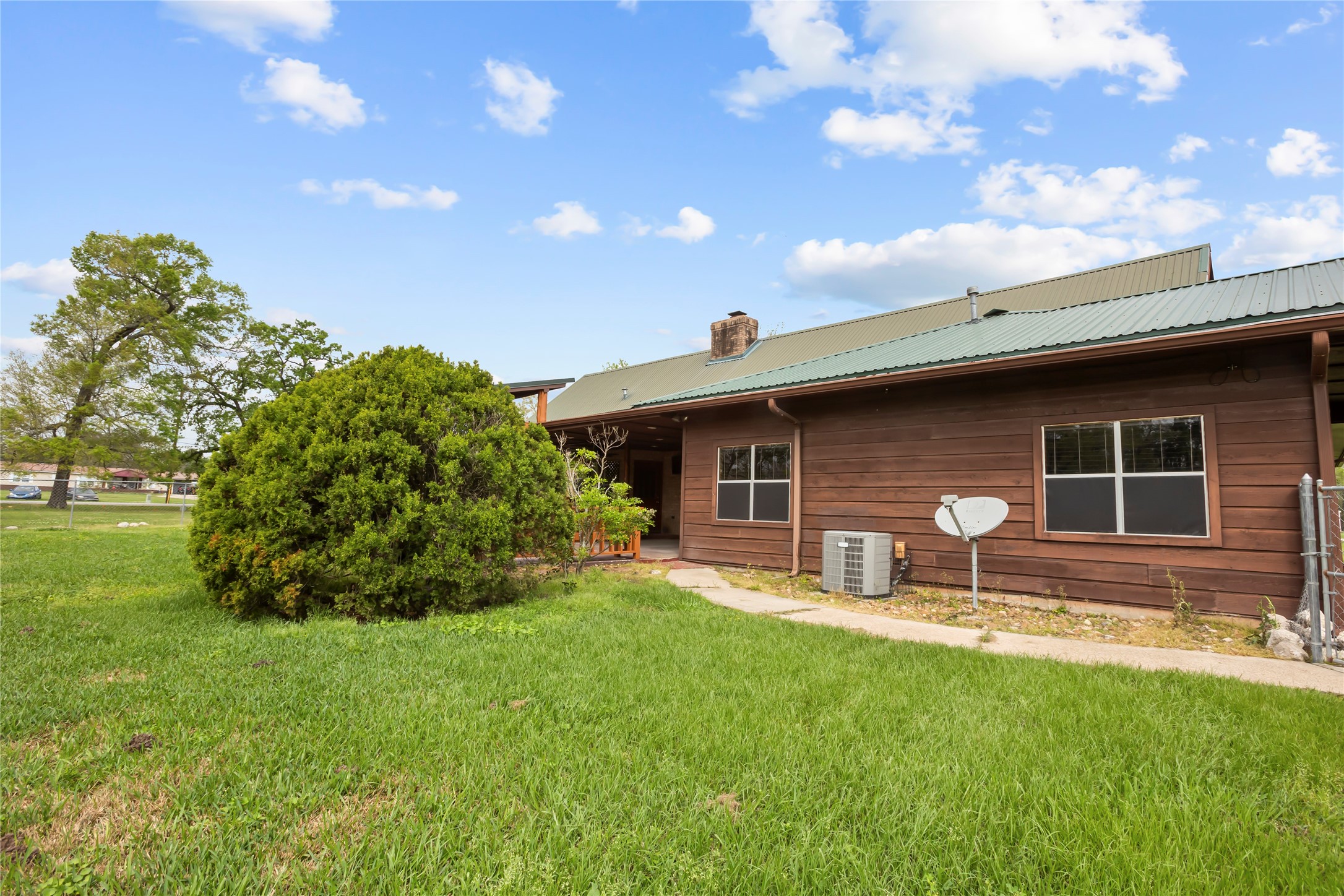 22916 East Martin Drive Porter, TX 77365 - Photo 39 of 43 a front view of a house with a garden