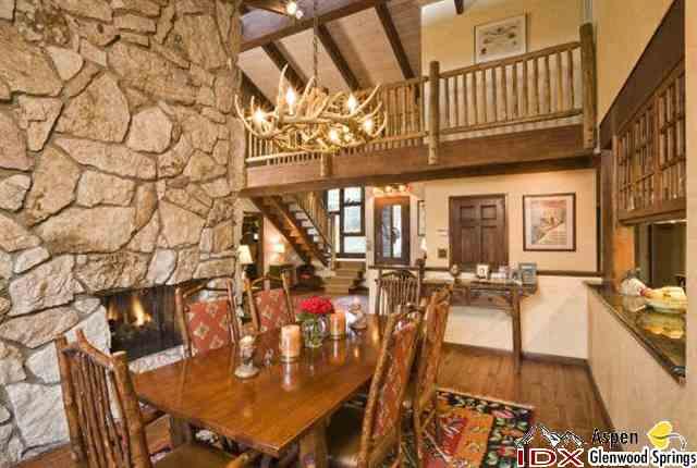 205 Glen Eagle Drive Aspen, CO 81611 - Photo 4 of 8 a view of a dining room with furniture and a chandelier