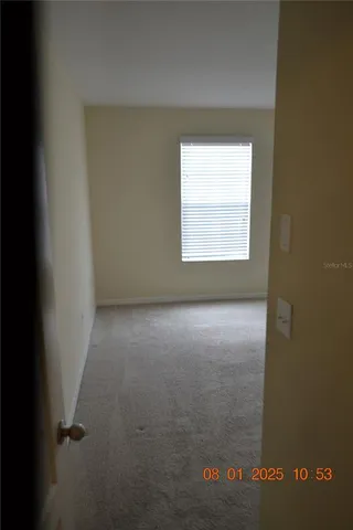 a view of a room that has a window in it