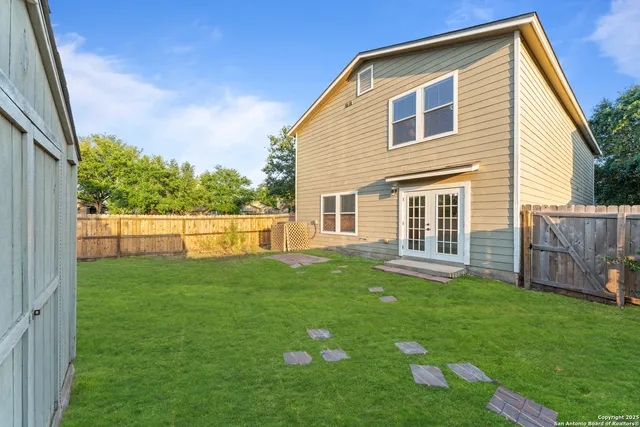 a backyard of a house with lots of green space