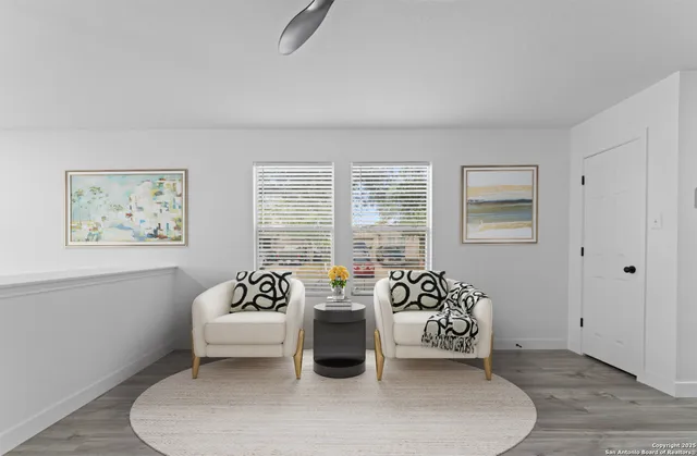 a bedroom with furniture and a window