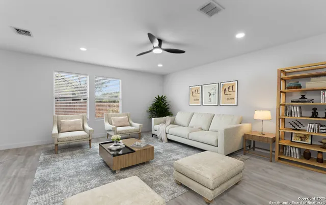 a living room with furniture and a large window