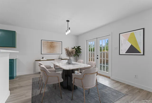 a view of a dining room with furniture window and wooden floor