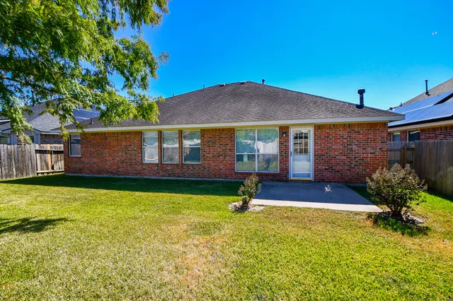 a front view of a house with yard