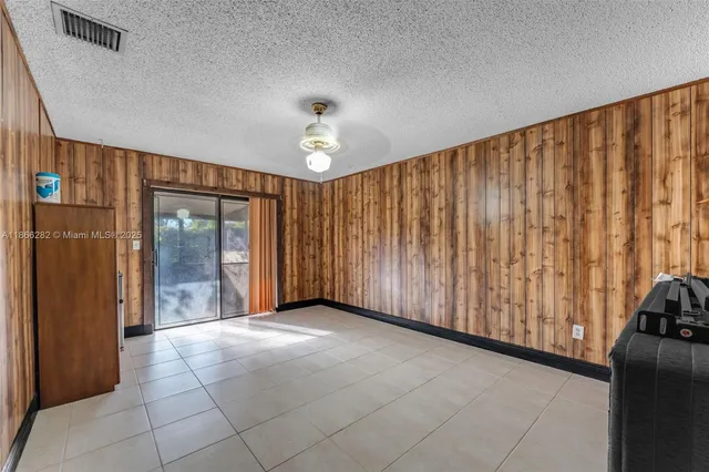 a view of a room with a large window