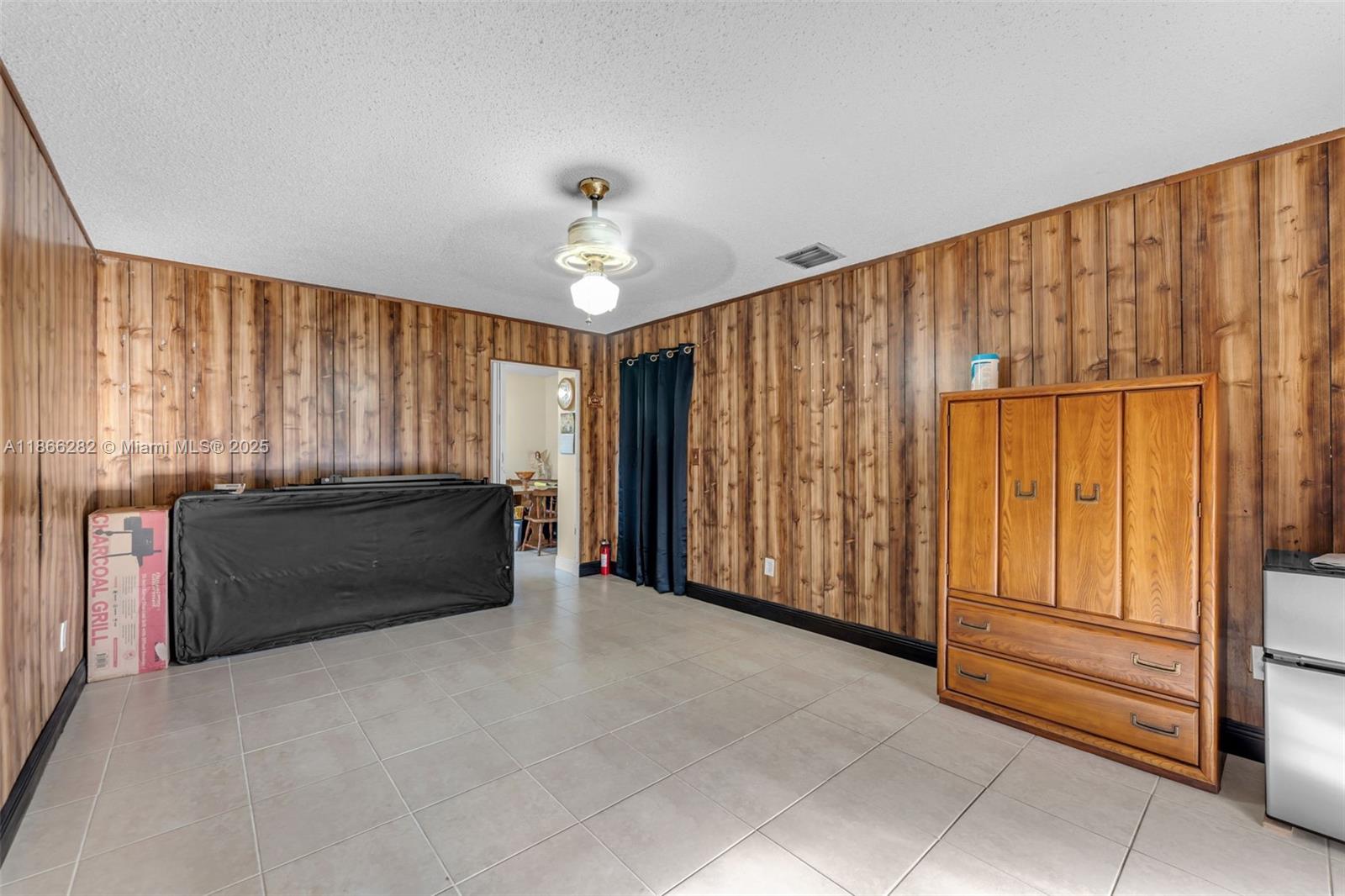 13231 Southwest 86th Street Miami, FL 33183 - Photo 12 of 31 a view of an empty room with a window