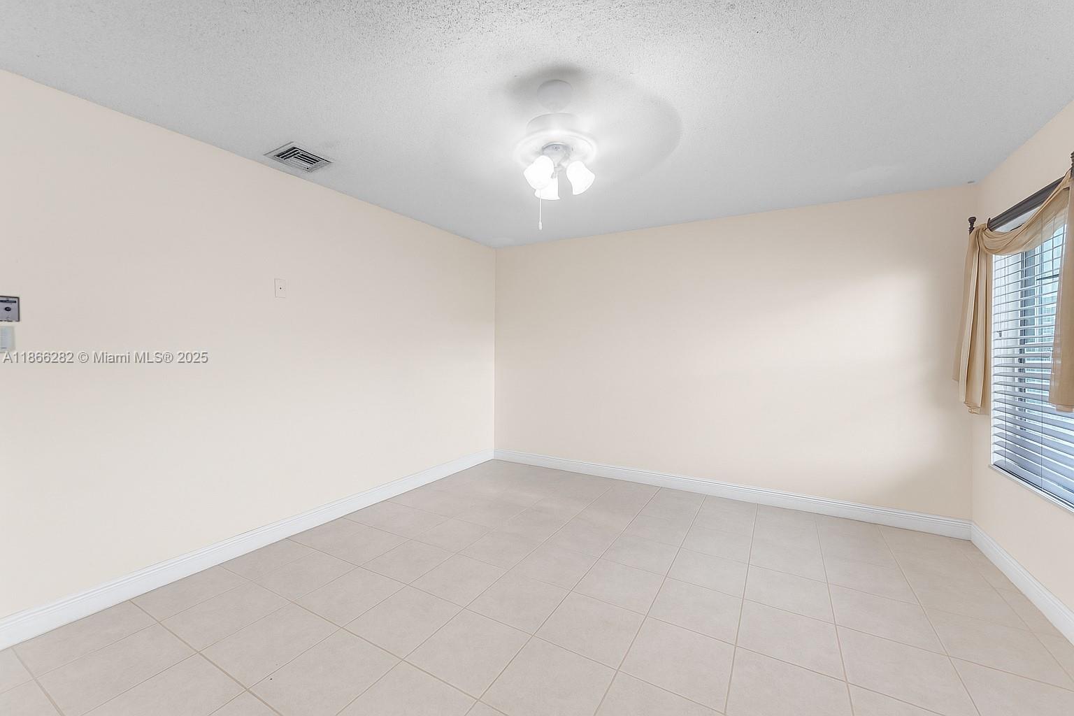 13231 Southwest 86th Street Miami, FL 33183 - Photo 15 of 31 an empty room with a empty space and windows