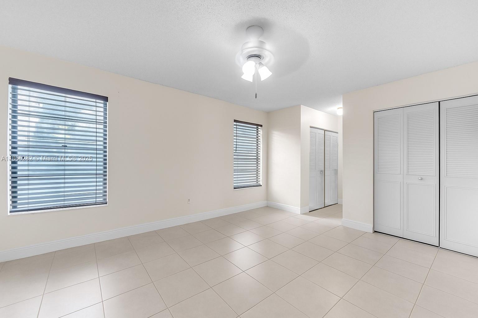 13231 Southwest 86th Street Miami, FL 33183 - Photo 16 of 31 a view of an empty room with a window