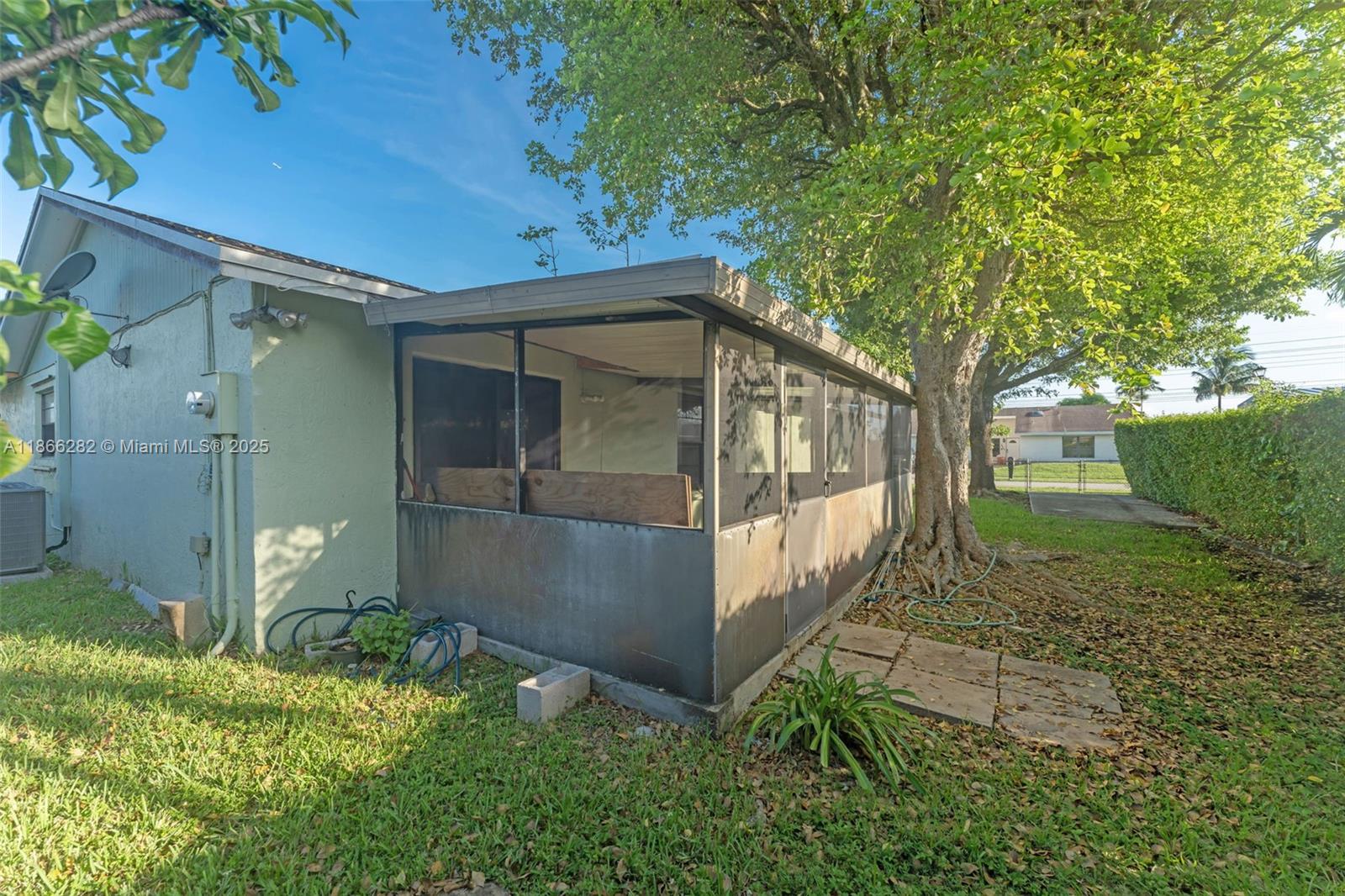 13231 Southwest 86th Street Miami, FL 33183 - Photo 19 of 31 a view of a house with a yard