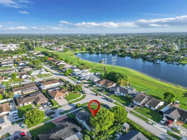 an aerial view of lake and residential houses