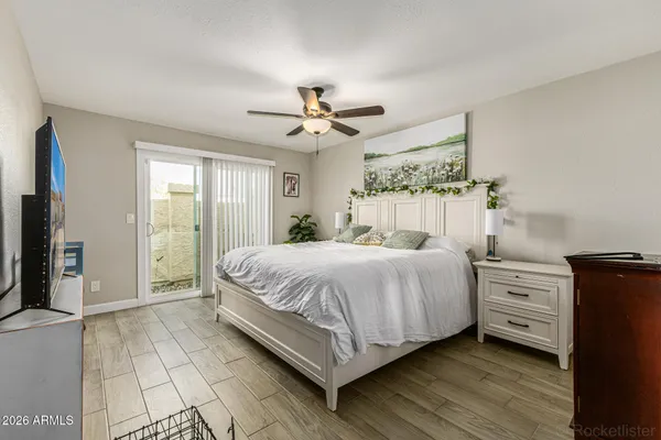 a bedroom with a bed and a chandelier