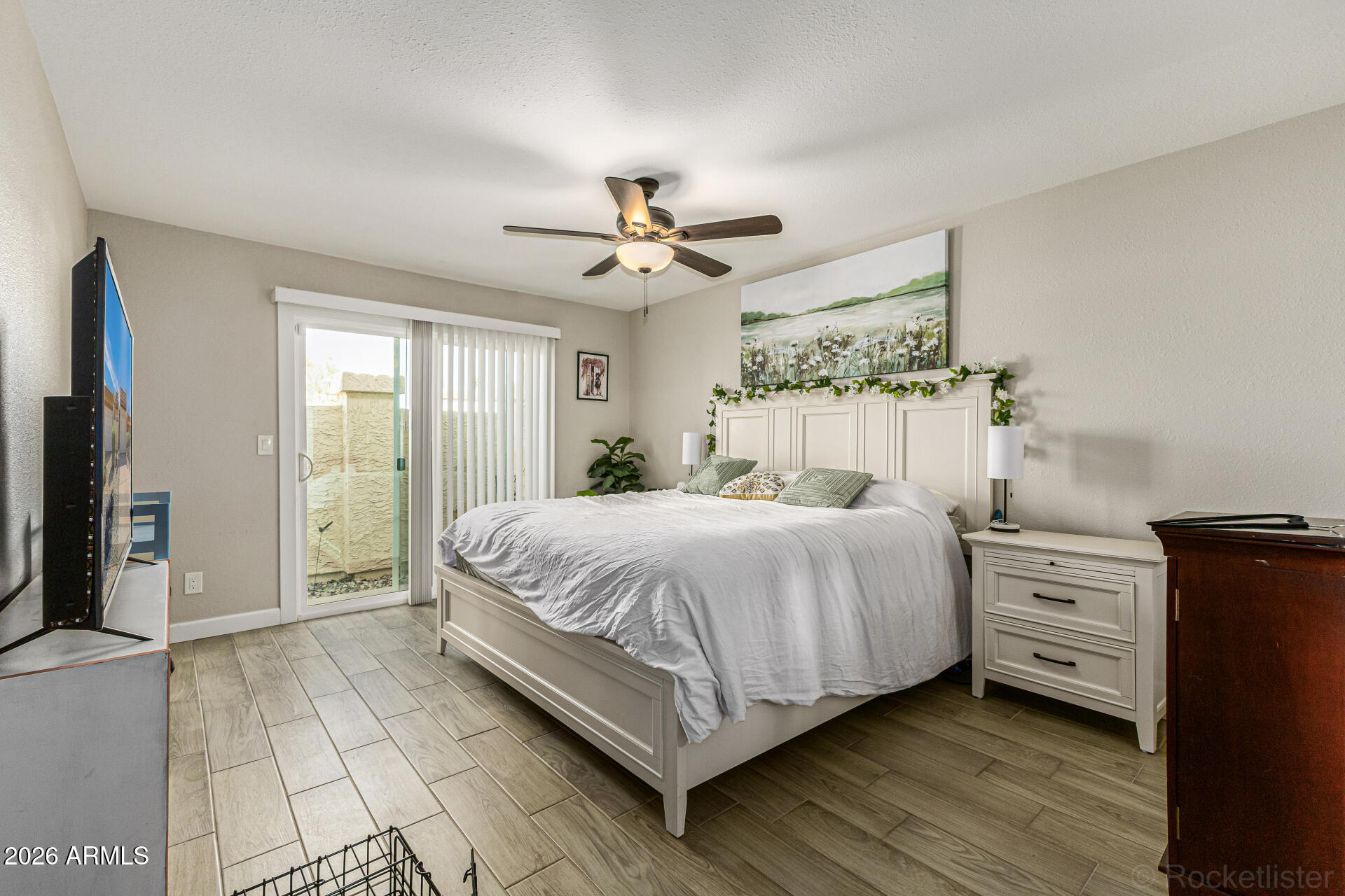 847 West Rice Drive Tempe, AZ 85283 - Photo 15 of 40 a bedroom with a bed and a chandelier