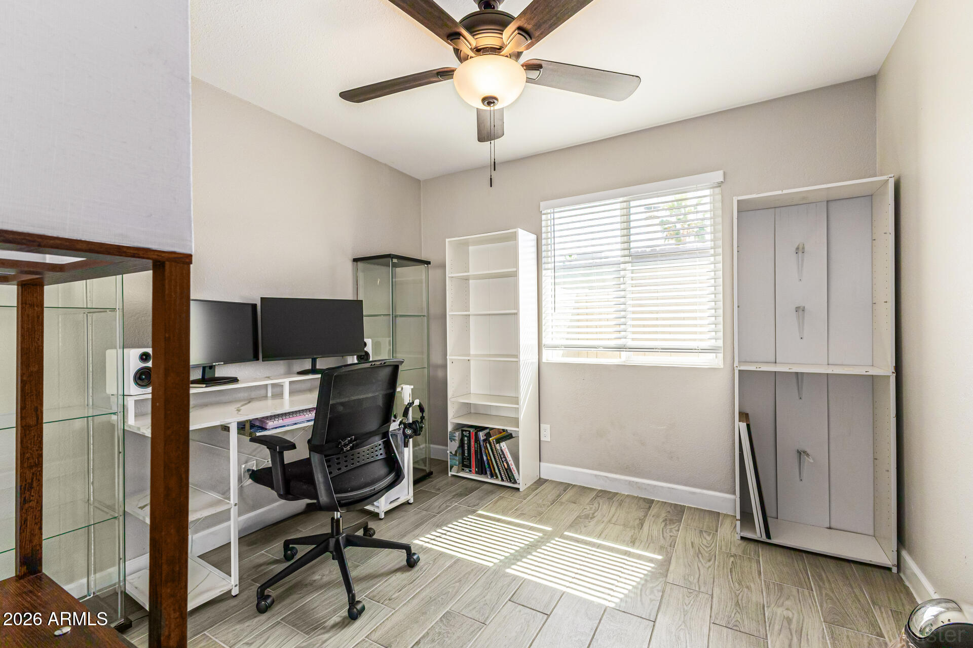 847 West Rice Drive Tempe, AZ 85283 - Photo 22 of 40 a view of a workspace with furniture and a window