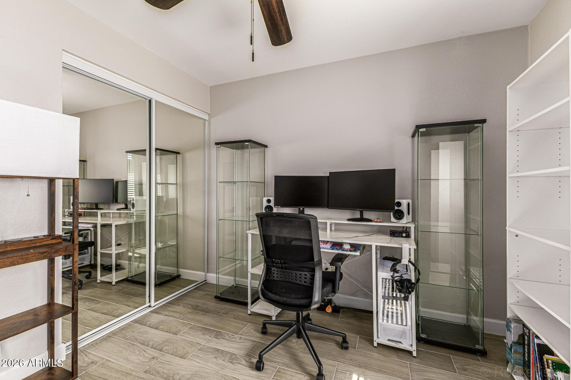 847 West Rice Drive Tempe, AZ 85283 - Photo 23 of 40 a view of a workspace with furniture and a flat screen tv