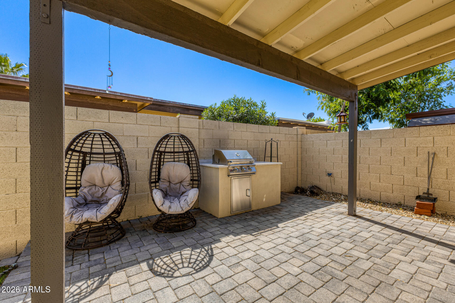 847 West Rice Drive Tempe, AZ 85283 - Photo 27 of 40 a backyard of a house with barbeque oven and wooden fence