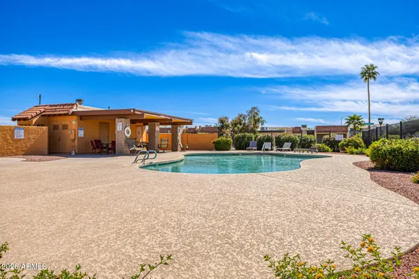 a view of a swimming pool with an outdoor seating
