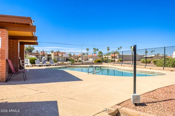 a view of a swimming pool and a yard