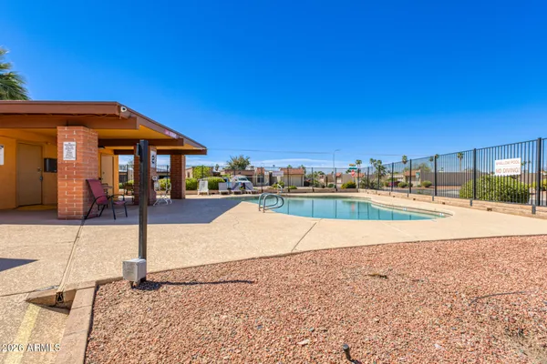 a view of a swimming pool and a chairs