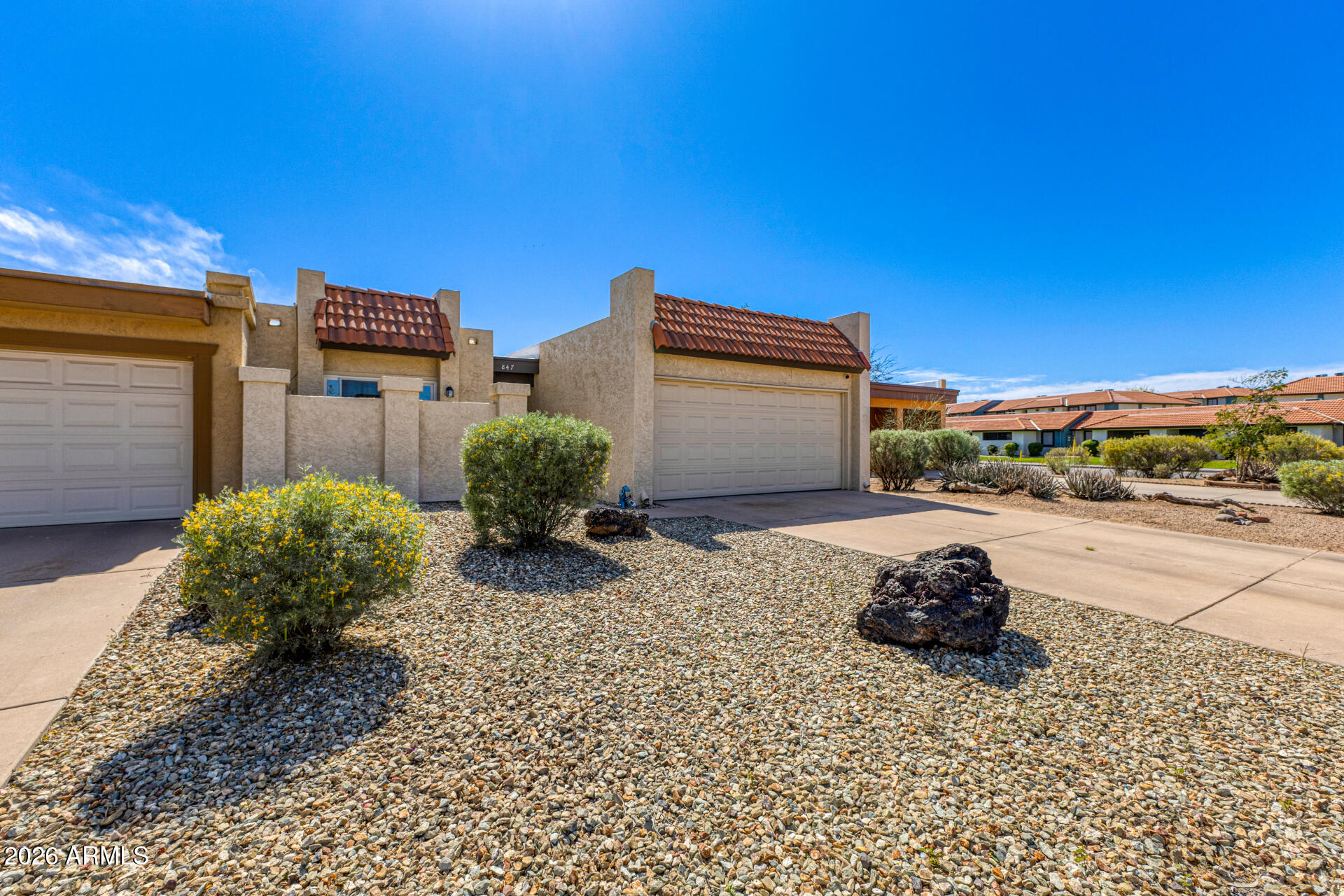 847 West Rice Drive Tempe, AZ 85283 - Photo 4 of 40 a street view with a building and trees in the background