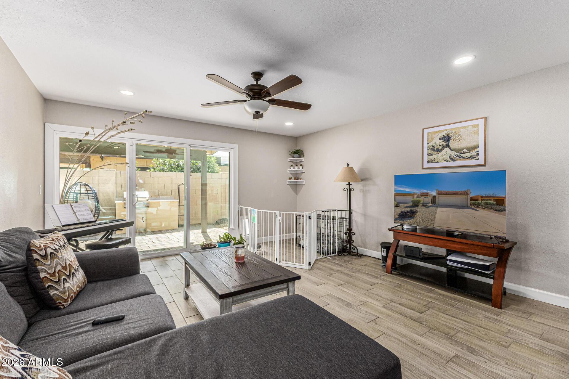 847 West Rice Drive Tempe, AZ 85283 - Photo 6 of 40 a living room with furniture a wooden floor and a large window