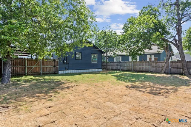 a house with trees in front of it