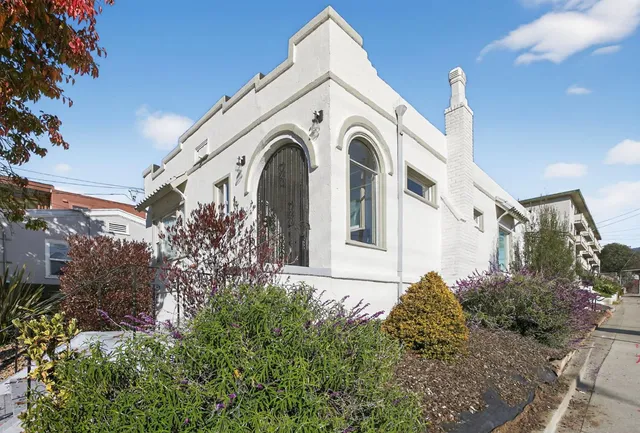 a view of a house with a small yard