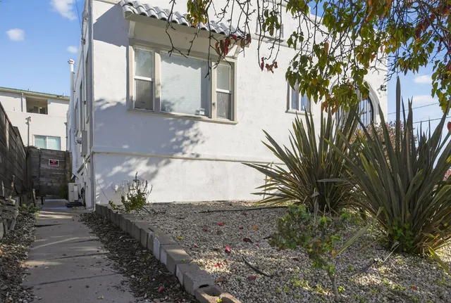 a view of a house with a tree