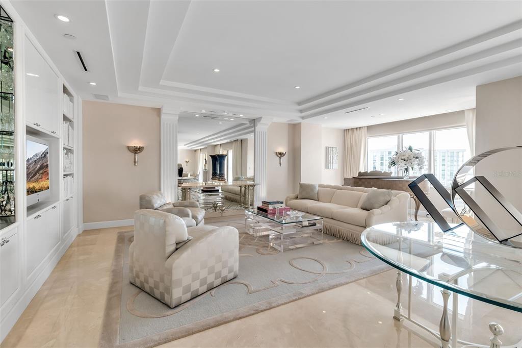 1111 Ritz Carlton Drive, Unit 1202 Sarasota, FL 34236 - Photo 13 of 49 a living room with furniture and a large window