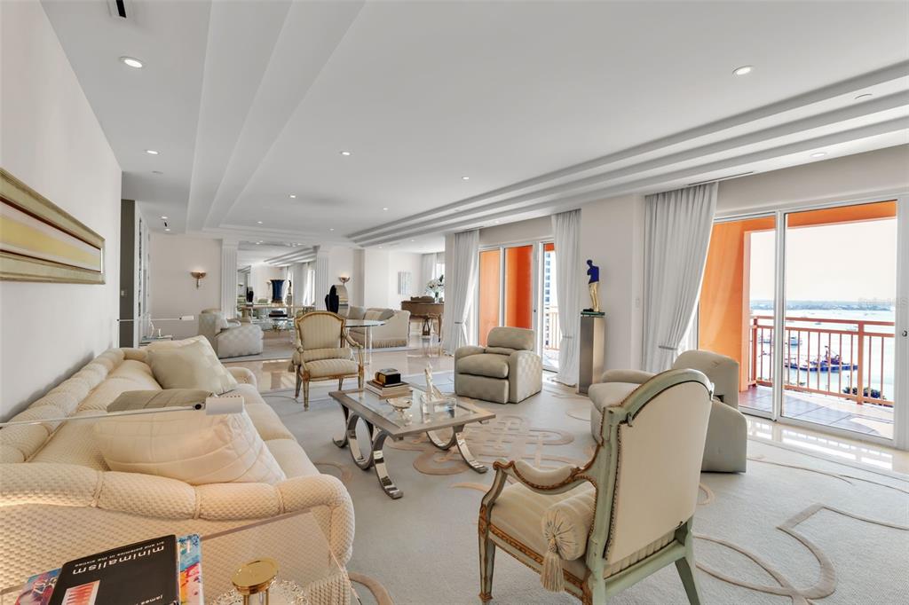 1111 Ritz Carlton Drive, Unit 1202 Sarasota, FL 34236 - Photo 16 of 49 a living room with furniture and a large window