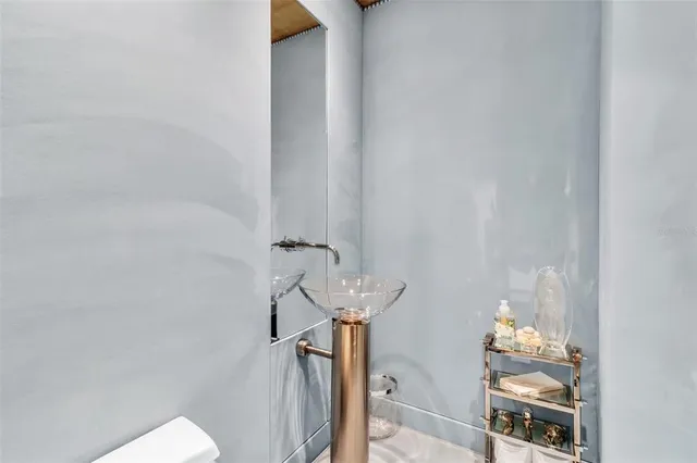 a bathroom with a sink and mirror