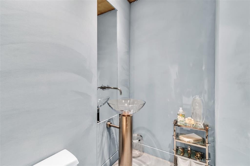 1111 Ritz Carlton Drive, Unit 1202 Sarasota, FL 34236 - Photo 18 of 49 a bathroom with a sink and mirror