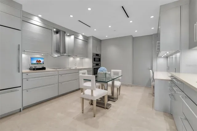 a kitchen with a sink cabinets and window