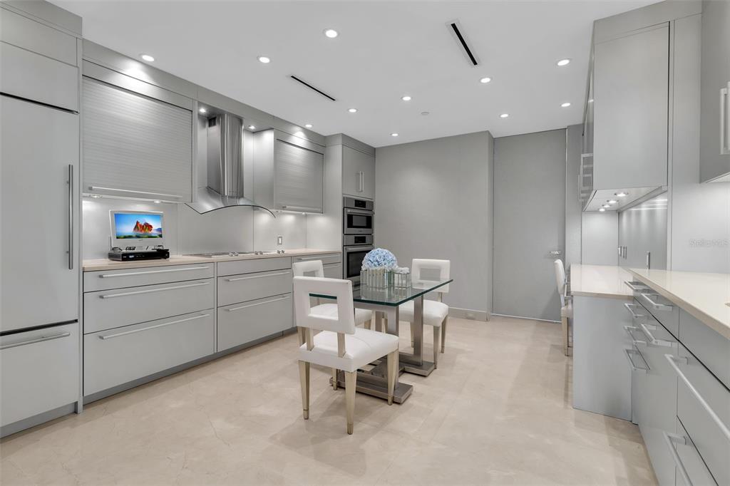 1111 Ritz Carlton Drive, Unit 1202 Sarasota, FL 34236 - Photo 22 of 49 a kitchen with a sink cabinets and window