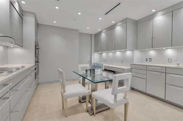 a kitchen with a sink cabinets and window