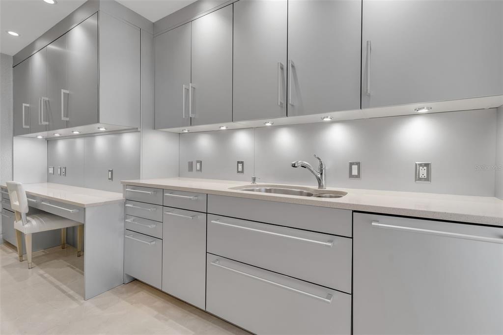 1111 Ritz Carlton Drive, Unit 1202 Sarasota, FL 34236 - Photo 24 of 49 a kitchen with sink and cabinets