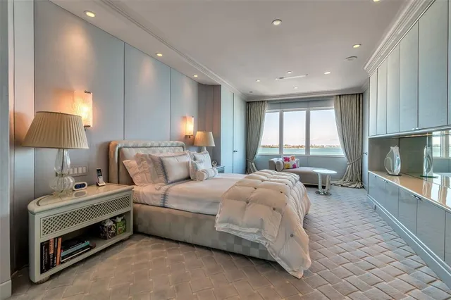 a bed room with a bed and a night stand