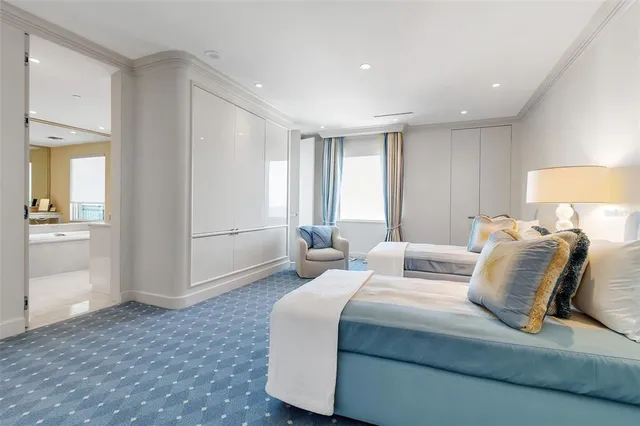 a bedroom with a bed and a mirror