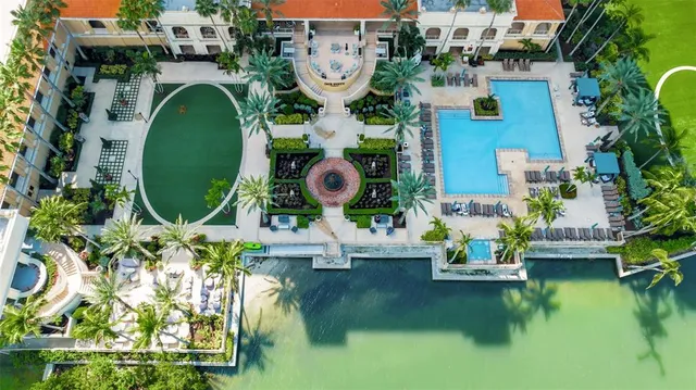 an aerial view of a house with swimming pool and outdoor space