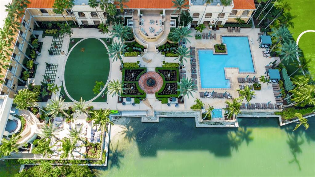 1111 Ritz Carlton Drive, Unit 1202 Sarasota, FL 34236 - Photo 4 of 49 an aerial view of a house with swimming pool and outdoor space