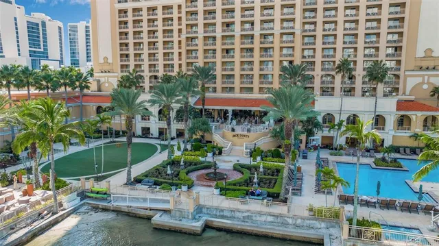 a view of building with outdoor space and swimming pool