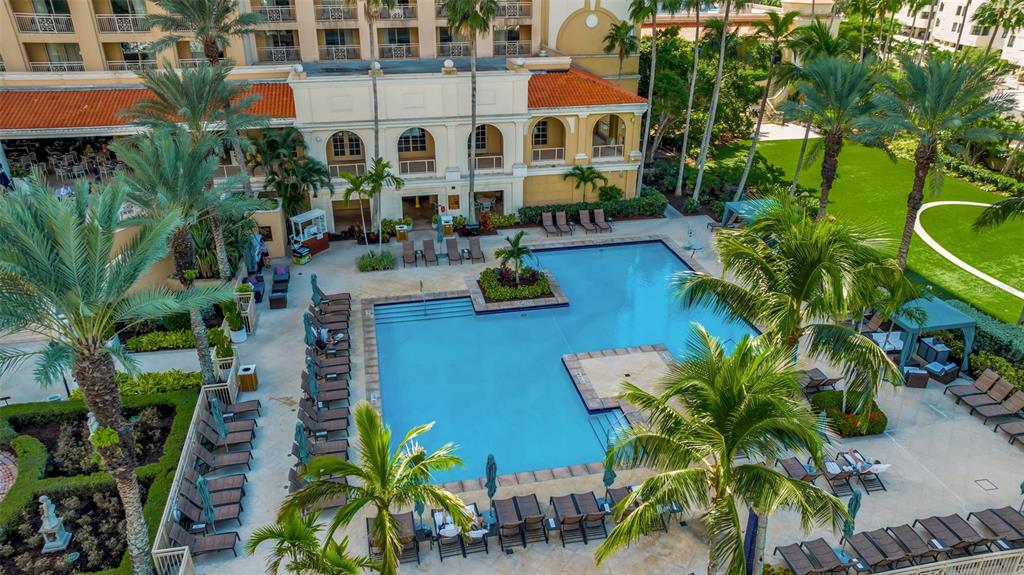 1111 Ritz Carlton Drive, Unit 1202 Sarasota, FL 34236 - Photo 7 of 49 front view of a house with a yard