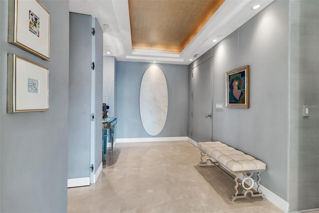 1111 Ritz Carlton Drive, Unit 1202 Sarasota, FL 34236 - Photo 9 of 49 a view of a hallway with entryway