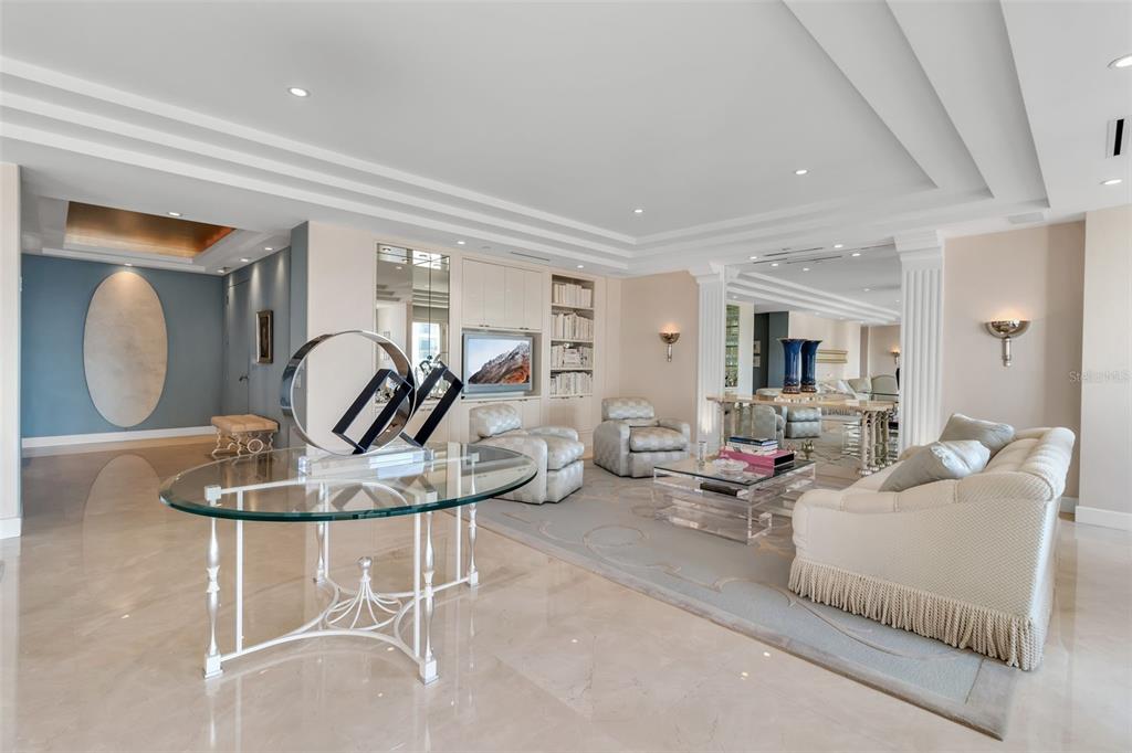 1111 Ritz Carlton Drive, Unit 1202 Sarasota, FL 34236 - Photo 10 of 49 a living room with furniture a large window and potted plants